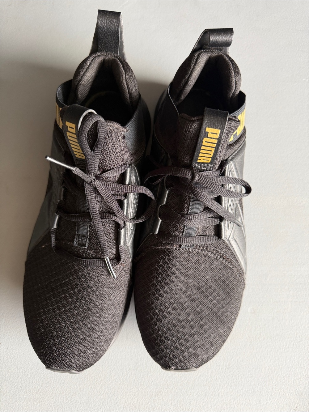 Puma Black Athletic Sneakers with Yellow Accents